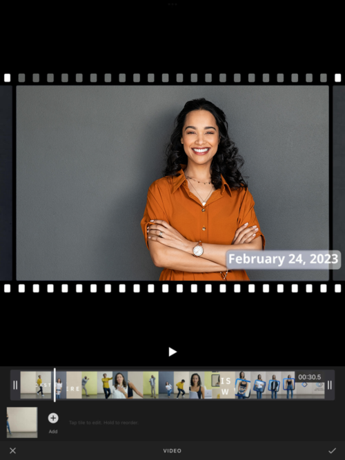 Smiling actress using the video editor tool on the Casting Networks app.