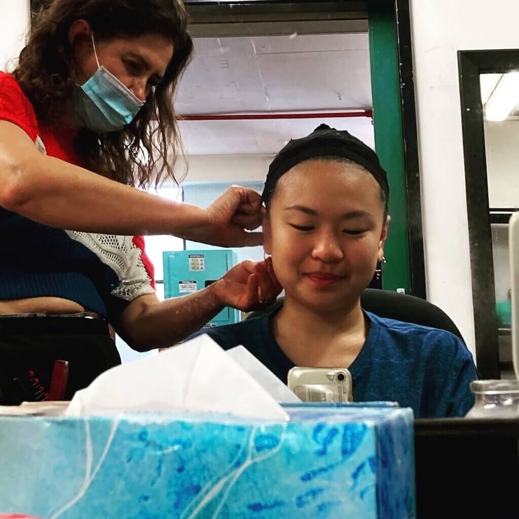 Grace Chow and a hair/makeup professional undergoing wig fitting for Opera.